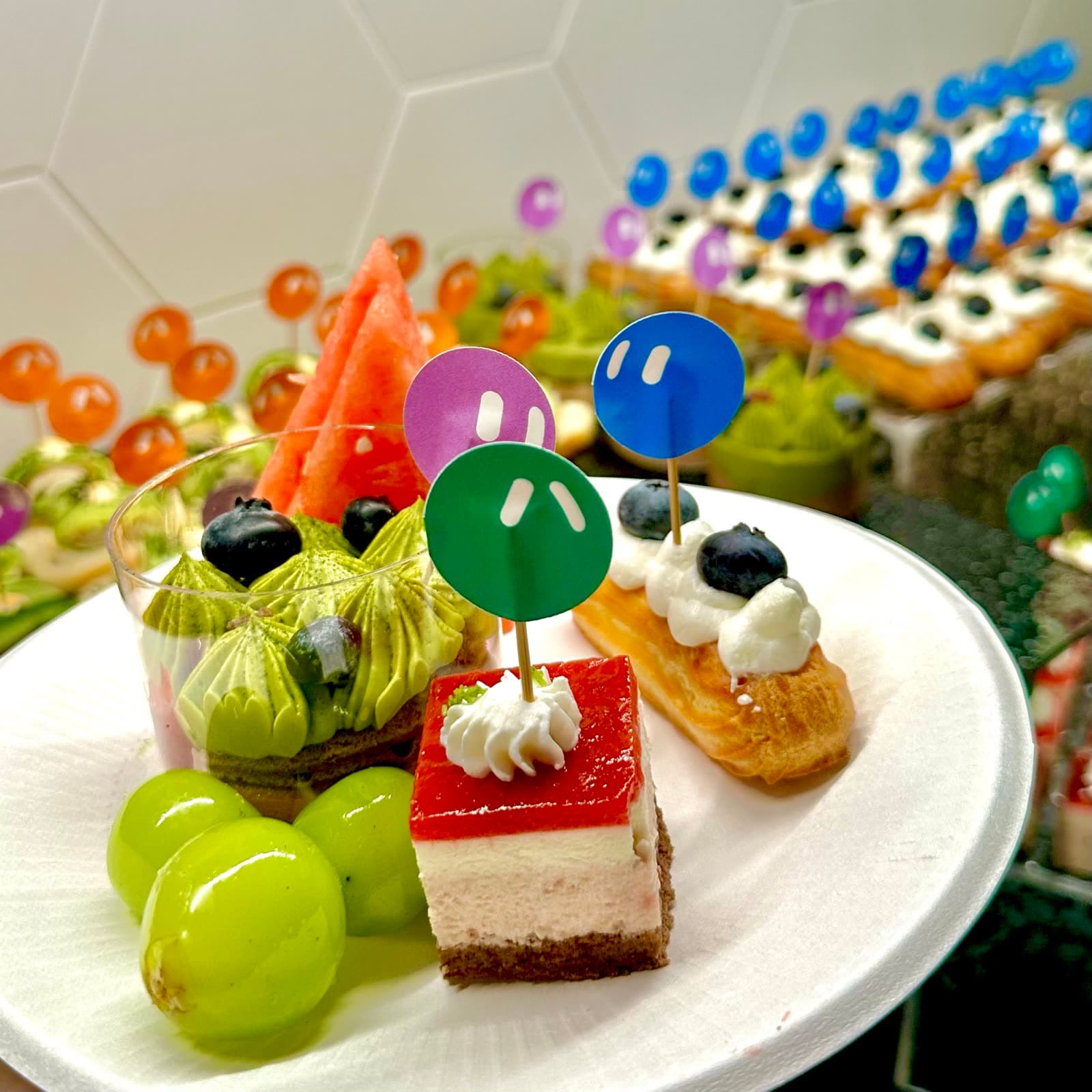Grok Bot Meetup Beijing: dessert plate with Bot-face toppers